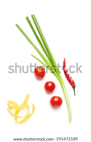 Mediterranean food and drink healthy cuisine: Colorful spicy Italian vegetables, herbs, spices.  Cherry tomatoes, onion, chili pepper, pasta. Top view. Isolated on white. Royalty-Free Stock Photo #595472189