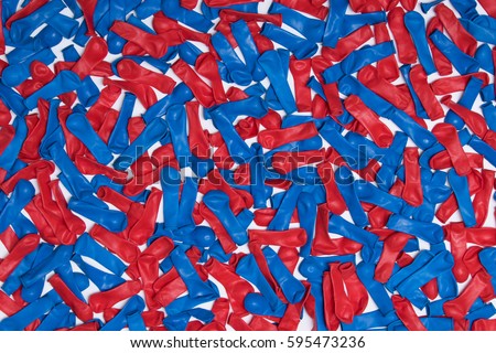 Balloon Background
Deflated red and blue balloons spread across a white surface