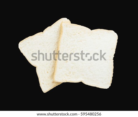 Closeup two slice bread for breakfast with shadow isolated on black background