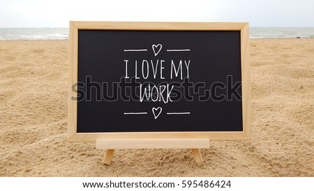 conceptual image with word I LOVE MY WORK on Chalkboard at beautiful beach background.  