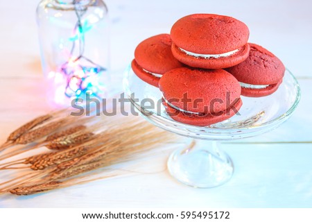 Red Velvet Whoopie Pie Vanilla Iced On a White Table Background / Selective focus