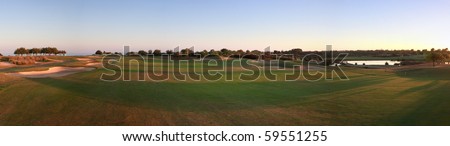 Panoramic picture of a golf course.