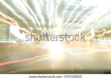 Blur background picture of light line on road at night when drunk driver drive by high speed. Concept of this picture is drunkenness driving. Imagination of drunken man