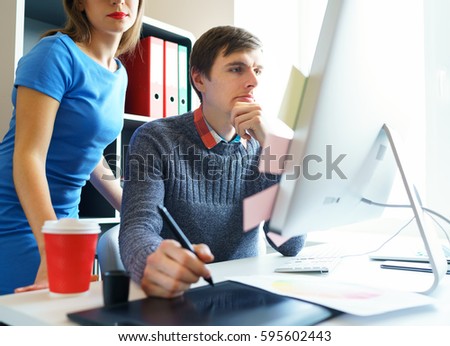 Beautiful young woman and man working from home office - modern business concept