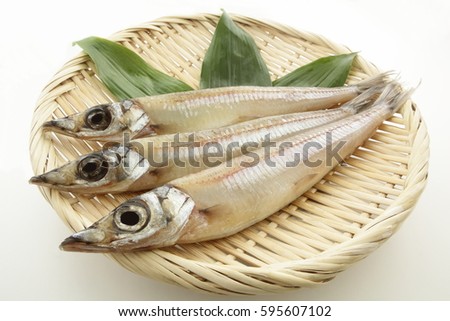 Dried Japanese silver whiting fish on white background/ Dried Fish, Sand Borer on colander