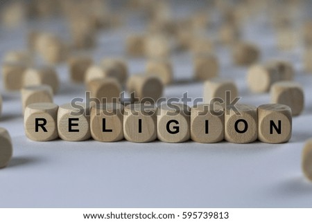 religion - cube with letters, sign with wooden cubes