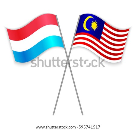 Luxembourgish and Malaysian crossed flags. Luxembourg combined with Malaysia isolated on white. Language learning, international business or travel concept.