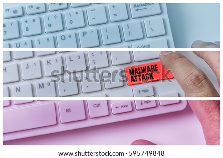 Close up of hand pressing word MALWARE ATTACK on white keyboard.