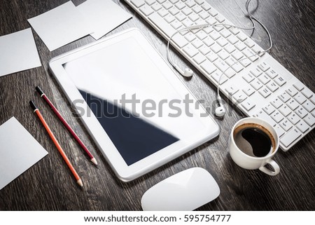 Business items notepad and stationary on wooden table