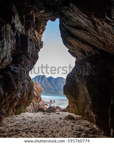 Cave at the beach in Coolbay Cape Town South Africa Royalty-Free Stock Photo #595760774
