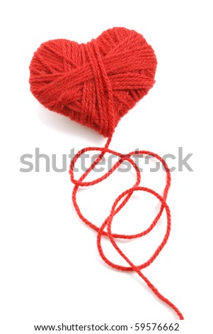 Red heart shape symbol made from wool isolated on white background