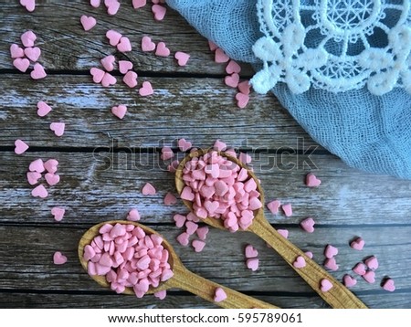  wooden spoons with pink sugar hearts. Love hashtag.Concept love background.
