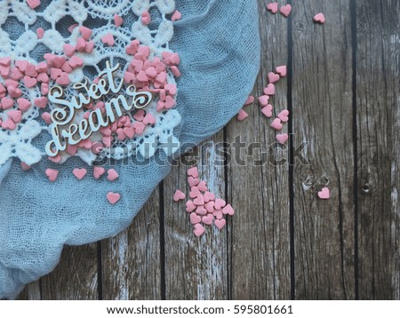 sweet dreams wooden text with small pink hearts. concept sweet dreams wallpaper. 
