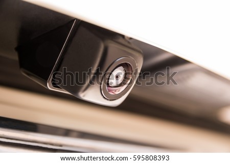 Small camera attached to car/Car rear camera Royalty-Free Stock Photo #595808393
