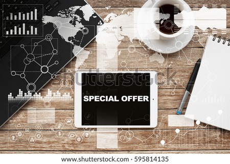Tablet on desktop with special offer text.