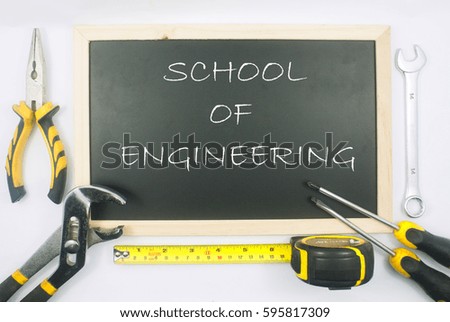 equipment tools and mini blackboard with word school of engineering concepts isolated on white background