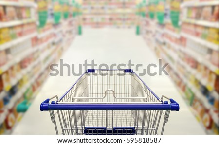 Abstract blurred photo of  supermarket with empty shopping cart shopping concept. Royalty-Free Stock Photo #595818587
