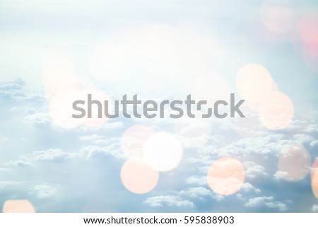 blurred beautiful blue natural sky clouds landscape background with bokeh lights