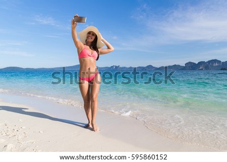 Young Woman On Beach Taking Selfie Photo On Cell Smart Phone Summer Vacation, 