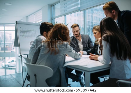 Group of architects and business people  working together and brainstorming Royalty-Free Stock Photo #595897442