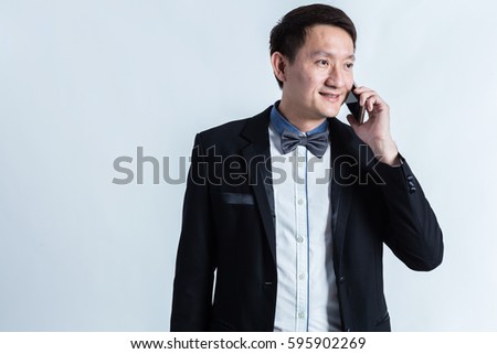 smart attractive asian adult male wear formal suot with tie hand using smartphone communication connecting business deal contract isoalte white background
