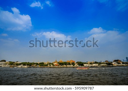 Another view of the Chao Phraya River in Thailand overlooks the palace as a tourist attraction.