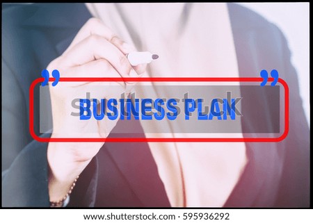 Hand and text  "BUSINESS PLAN" with vintage background. Technology concept.
