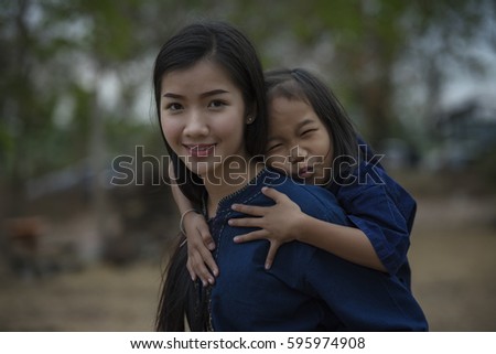 Mother's Day, pictures of moms with babies smiling bright at camera, beautiful Asian smile in Asia and laughing together.