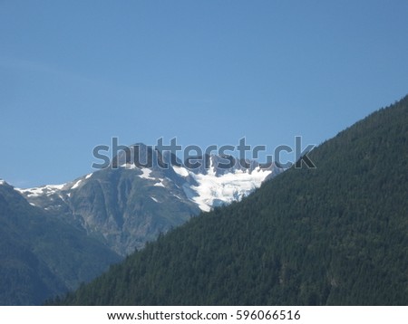 Snow capped mountain in Canada during summer