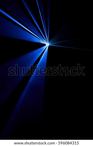 Laser beam blue on a black background 