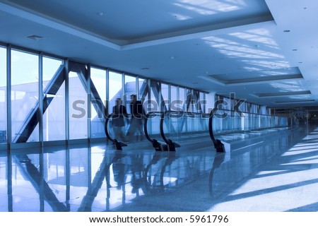 moving people near the escalator in the office hall