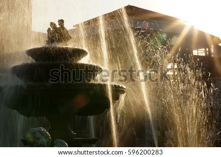 The fountain light from the sun hits the beautifully. The fountain of the sun light falls beautifully
