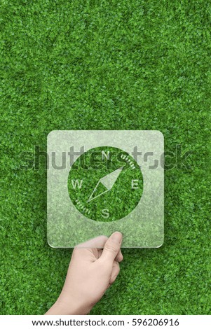 Compass symbol message box with green grass background
