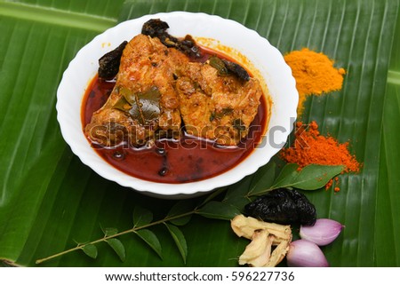 Very popular Kerala fish curry with white rice in coastal area south Indian and Sri Lanka, Malaysia, Thailand, Singapore. made by marinated mackerel fish with Indian spices. sea food in clay / mud pot
