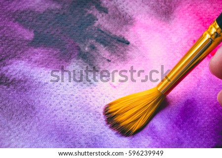 Abstract Hand painted Watercolor Colorful wet texture background with paint brushes on paper. picture for creative wallpaper or design art work. Pastel colors tone