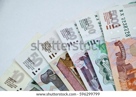 various russian banknotes in shape of fan on a white surface