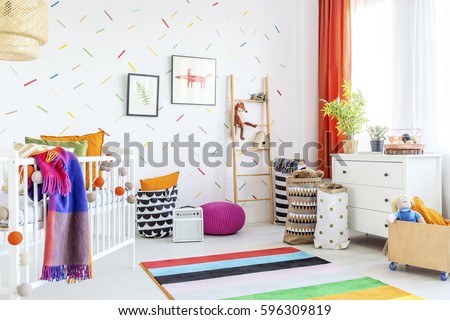 Cozy modern baby room decor with white floor and colorful additions