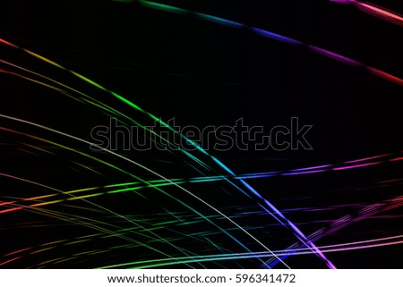 Abstract image of colorful lights blurred by motion on  black background