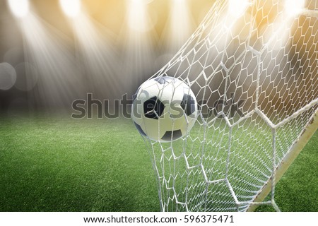 soccer ball in goal Royalty-Free Stock Photo #596375471