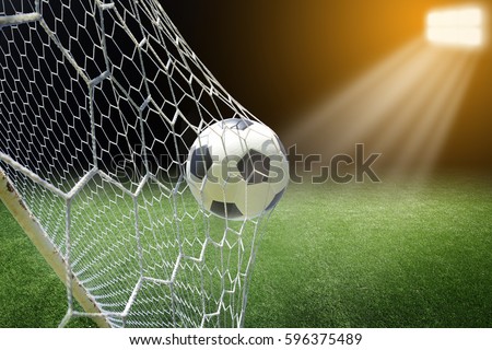 soccer ball in goal Royalty-Free Stock Photo #596375489