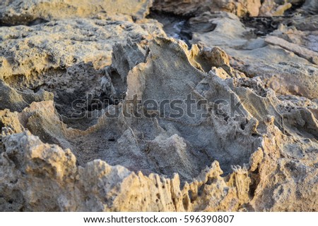 Sharp stones on the sea shore. natural background