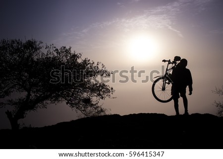 A man Silhouette With Bike