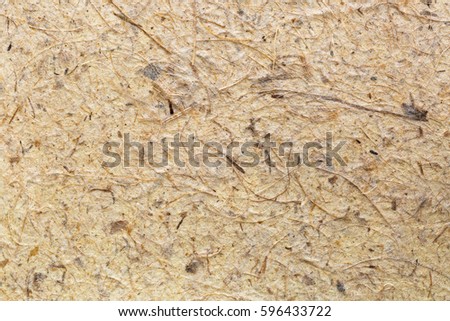Closeup background texture of handmade rice paper made of paper mulberry plant tree bark, full of fiber 
