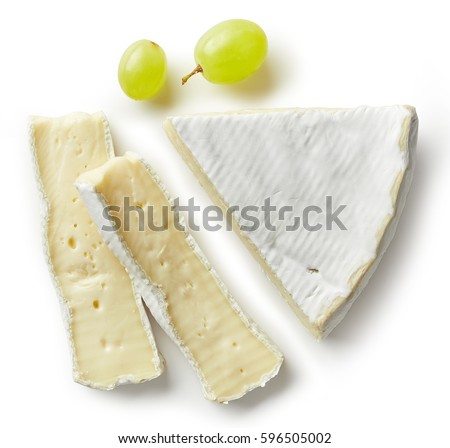 Piece of brie cheese isolated on white background. From top view Royalty-Free Stock Photo #596505002