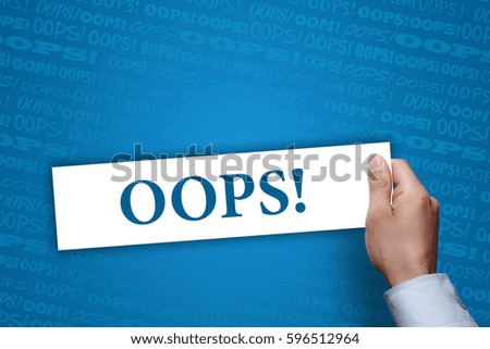 Businessman holding Oops! sign