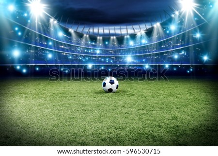Football pitch with green grass and blue light with free space for your decoration 