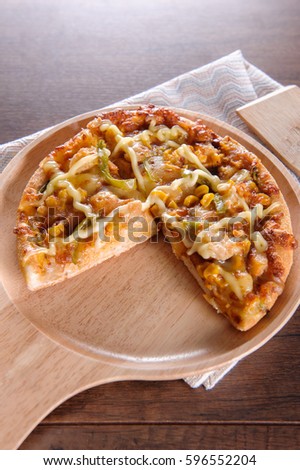 Delicious tasty pizza with on wooden table selective focus and copy space