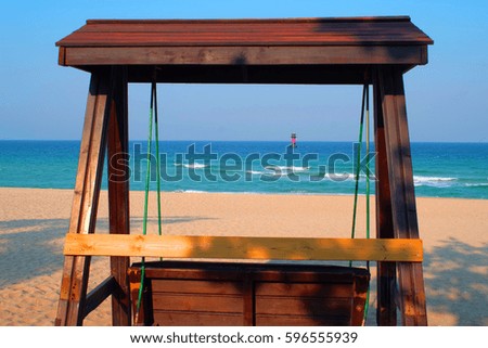 Shoreline with wooden bench