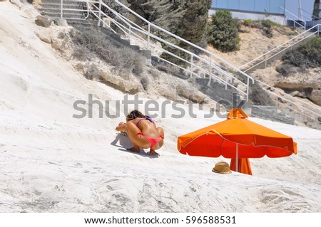 Girl making photos on the beach