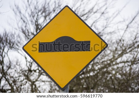 Ramps ahead sign - Yellow and black with rural background Irish Road Signs